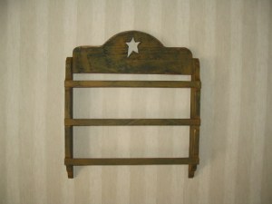 Kitchen Towel Rack has hole for mounting on the wall.   18" H x 15 3/4 w $24.00 