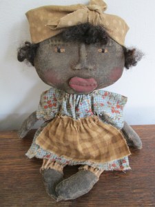 At 11", Lulu is just the right size for those small spaces. Her 'loons, apron and "do-rag" are all coordinated with her dress and she has sheeps wool hair peeking out from under her "do-rag". She'd love to b a little sister for some of your larger dolls. $36.00