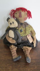 Annie is 18" tall but has a big bottom and is weighted heavily to sit, so she looks shorter. She loves her handmade panda and has a grungy tag attached with a rusty safety pin that says "Old Toys". Lots of detail! $68.00