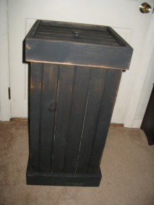 Wastebasket is  25" H x 15" W.  Rim comes off to keep 13 gallon trash bag securely in place.  $52.00